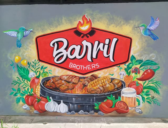 Mural de una parrilla con verduras y colibríes, con el rótulo Barril Brothers